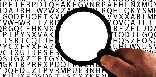 Buchstabenbild mit Lupe